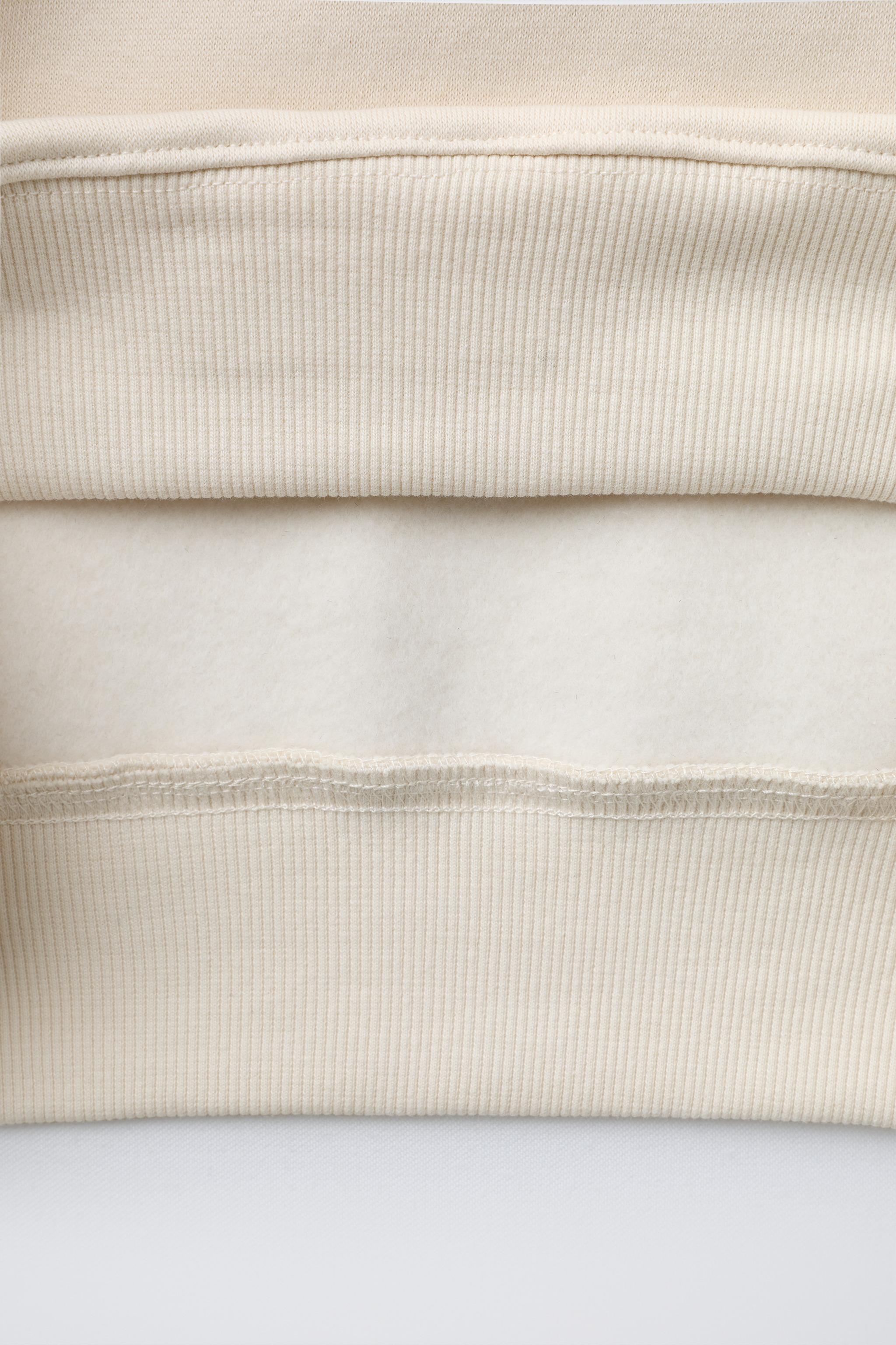 FLOCKED TEXT SWEATSHIRT